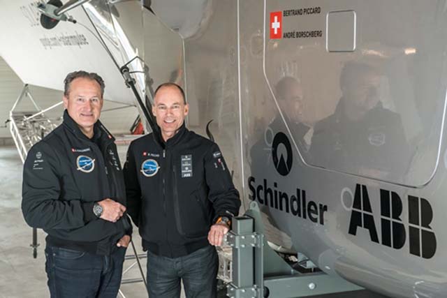 Payerne, Switzerland: (From left to right) André Borschberg, Co-founder and CEO and Bertrand Piccard, Initiator and Chairman are standing beside the cockpit of Solar Impulse 2, the single seater solar airplane with which they will attempt in 2015 the first round-the-world solar flight.