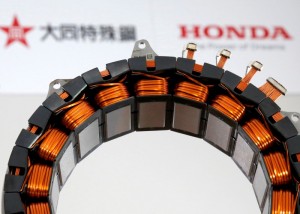 A unit for the the world's first electric motor for hybrid cars that uses no heavy rare earth metals jointly developed by Honda Motor Co. and Daido Steel Co. is displayed at an unveiling in Tokyo